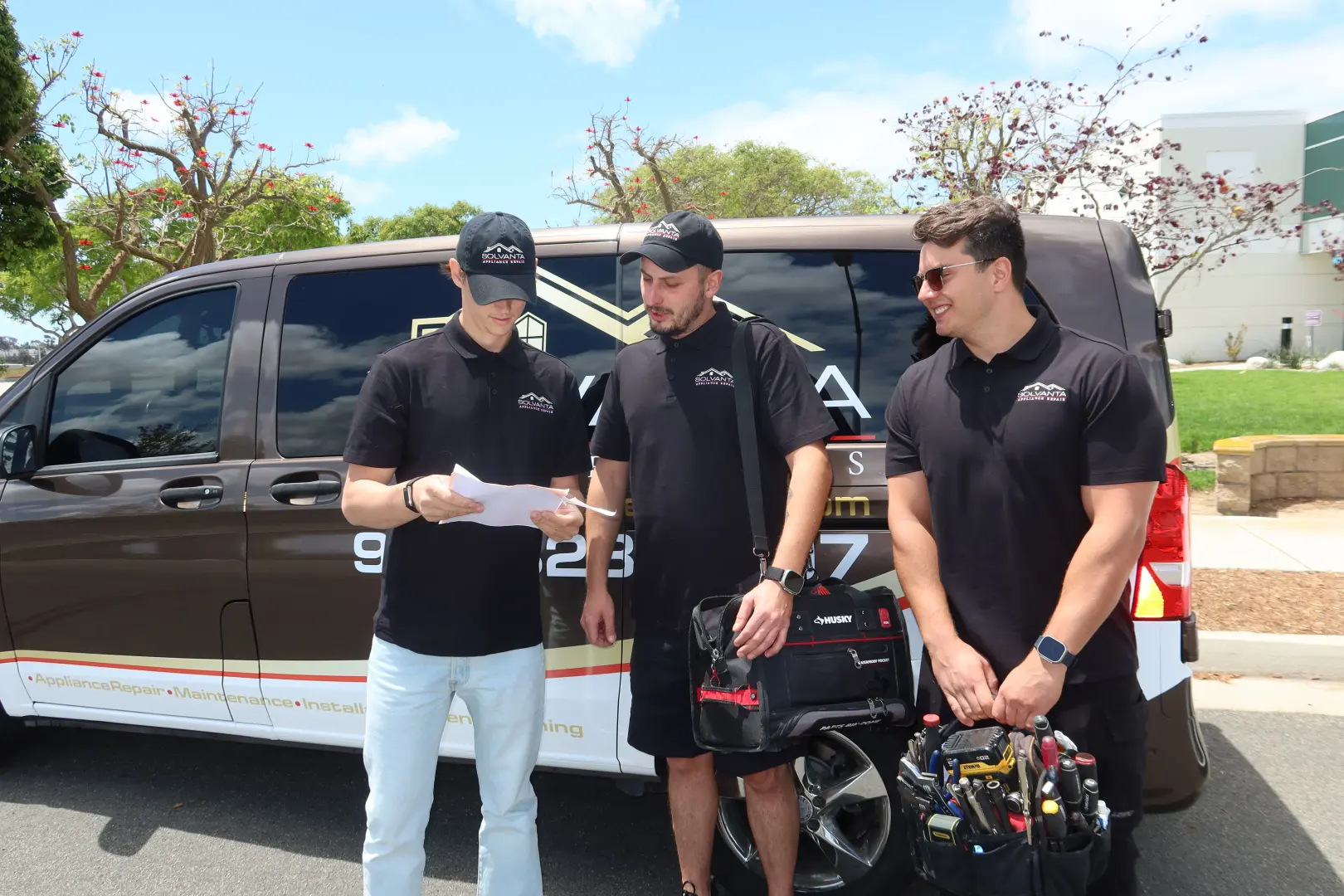 Solvanta Home Services technicians reviewing a work order before a repair
