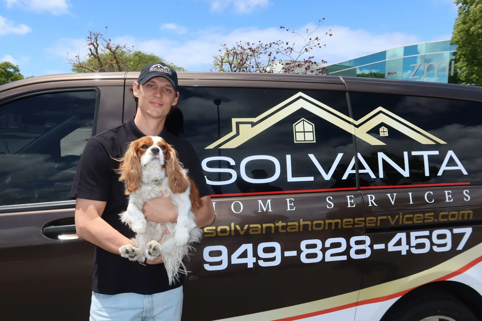 Solvanta Home Services technician with a client's dog