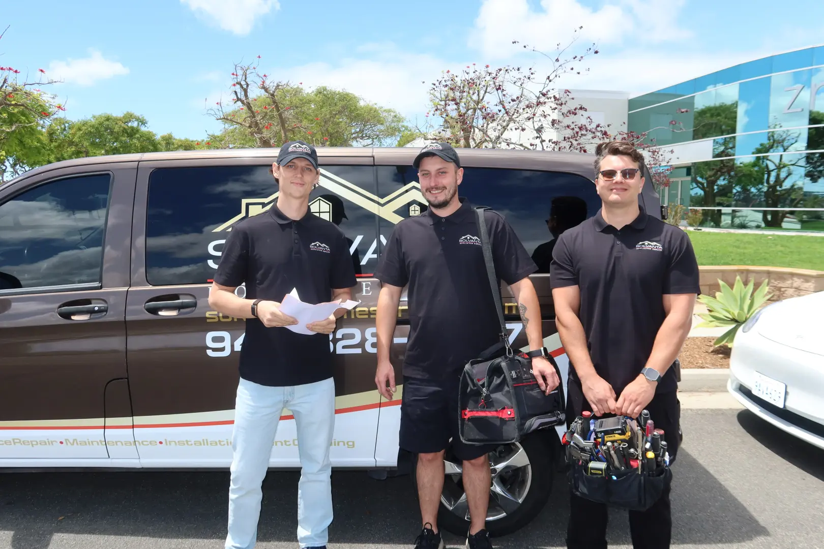 Solvanta Home Services technicians with their service van
